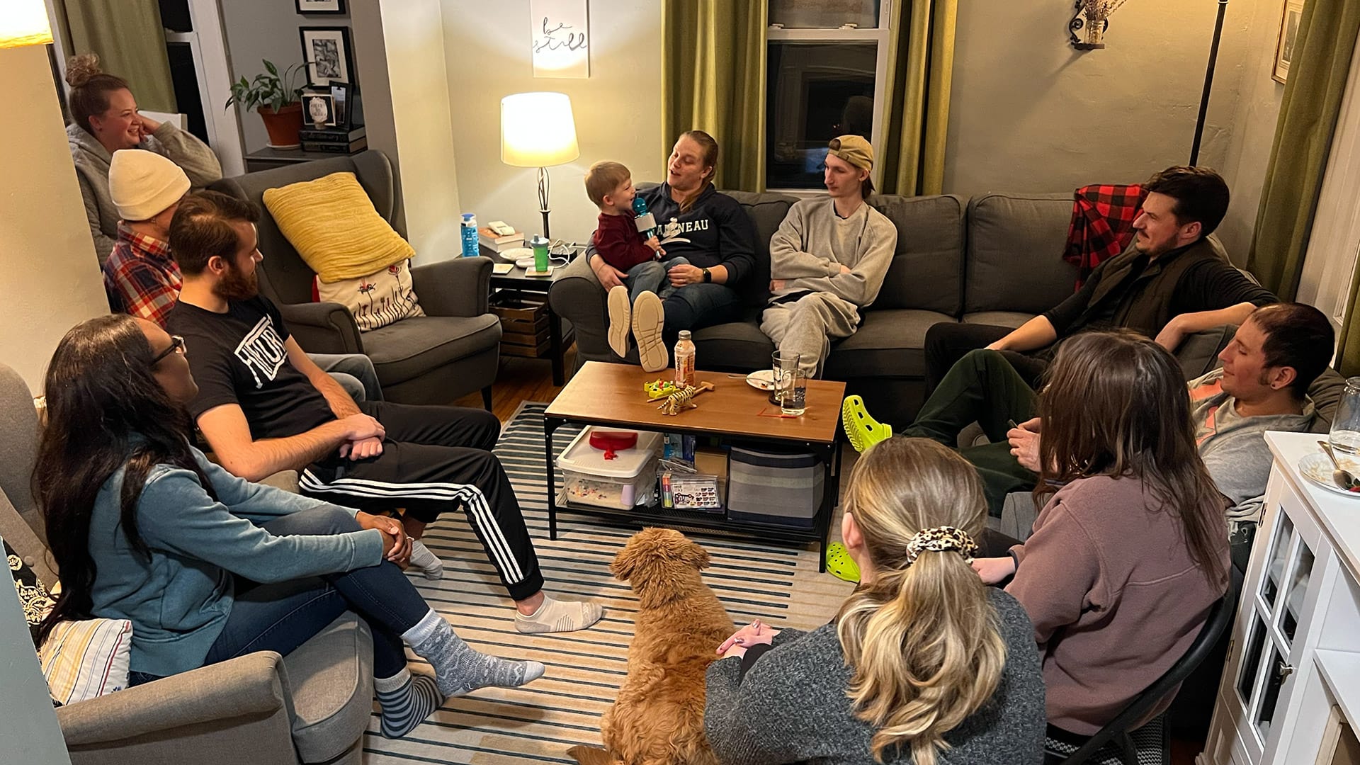 A small group from Antioch Community Church gathered in a cozy living room for fellowship and Bible study.